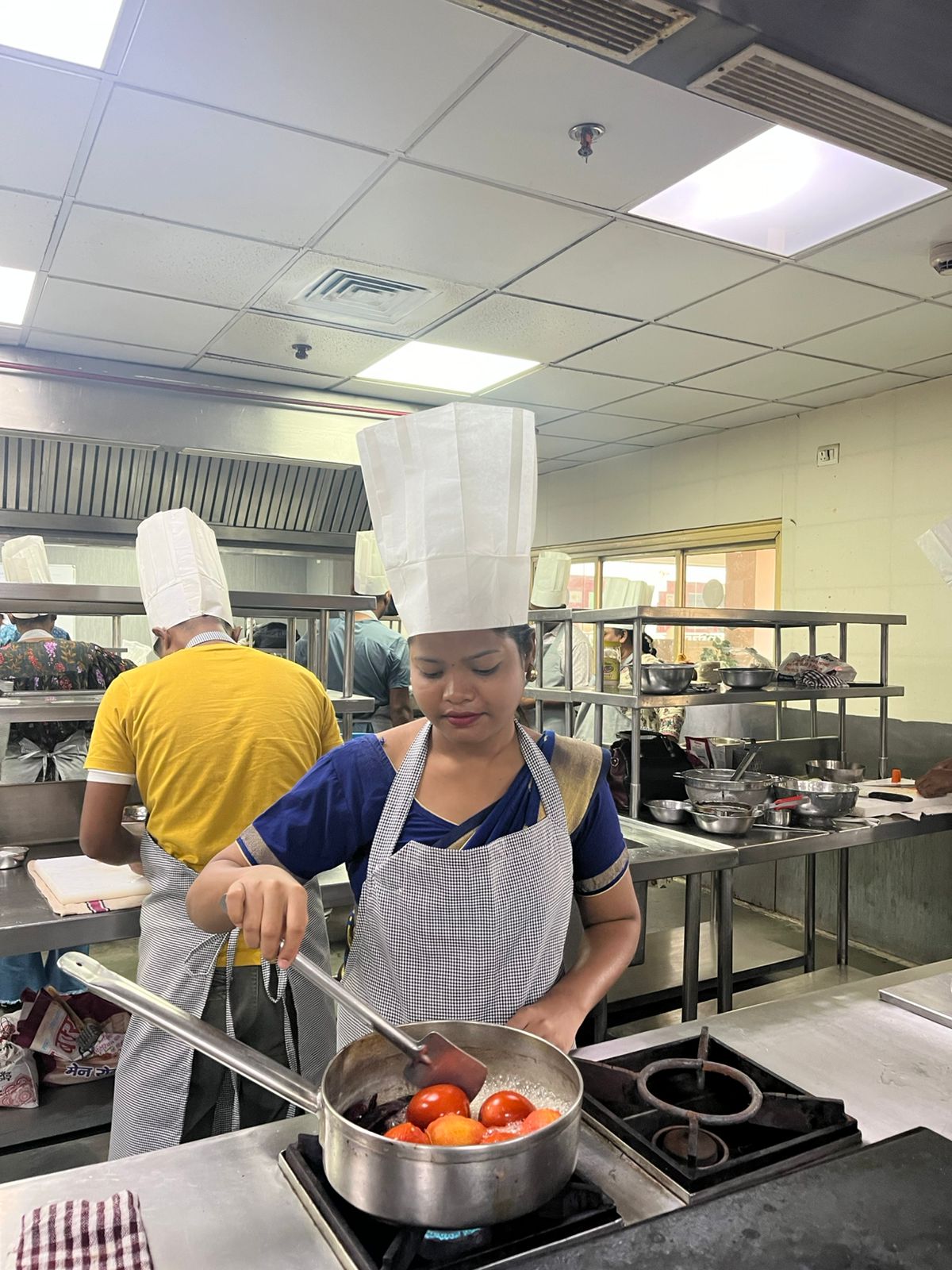 Chef preparing authentic tribal cuisine at JOMHA