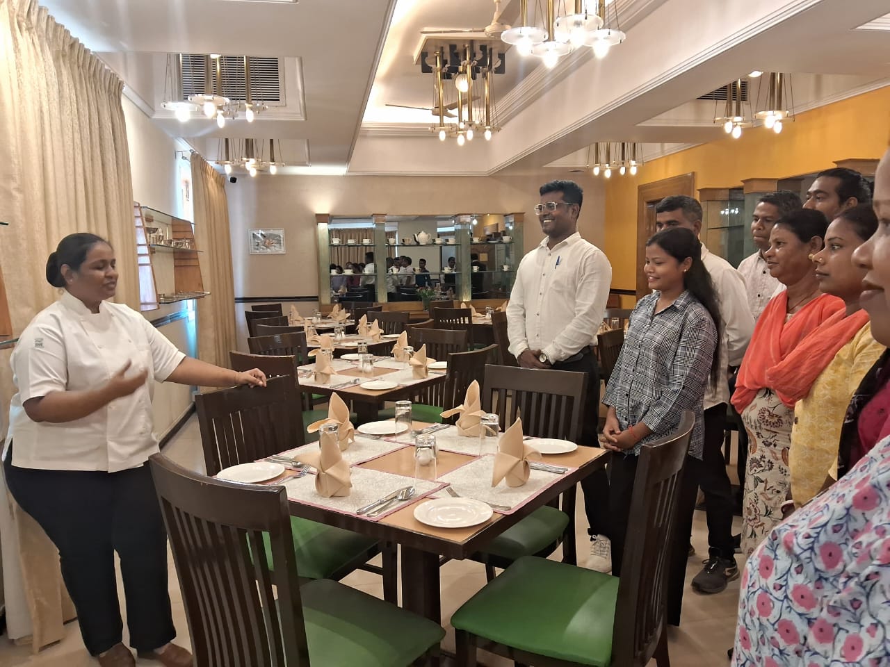 Chef presenting dining experience to guests at JOMHA Restaurant